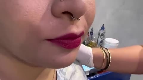 Cover lip's with tatoo