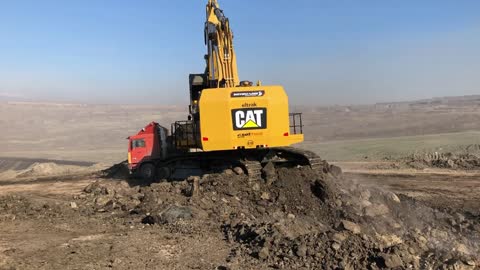 Caterpillar 6015B Excavator Loading Trucks With Two Passes - Sotiriadis Mining Works