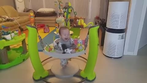 Little baby riding jumperoo