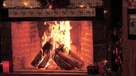 A fireplace lit at Christmas time