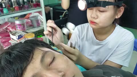 Clean ears, relax with a cute young girl at Vietnamese barber shop