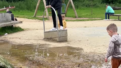 Mischievous Uncle Sprays Nephew With Water