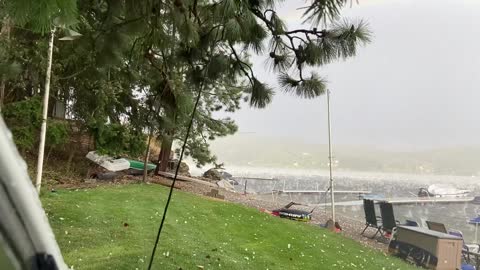 Double Rainbow in Hailstorm Over Lake