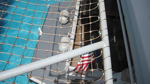 LCU entering the well deck of USS HARPERS FERRY; view from flight deck