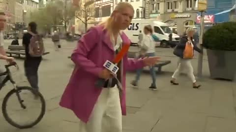 Pedestrian Takes out Cyclist with his Umbrella during Live TV Broadcast