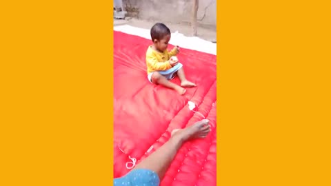 A baby enjoying his moments and his mother Angry because she work