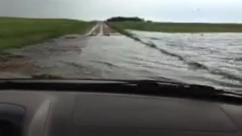 Man Drives Straight Through Flooded Road!