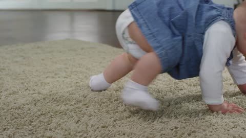 baby girl learning to walk