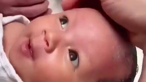 Newborn Baby makes funny expressions when they wash their Hair.