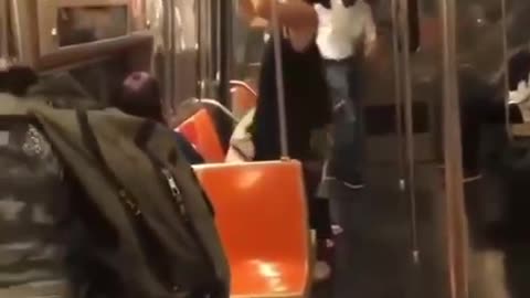 Woman on train tearing down posters NORMALIZING SEXUALITY