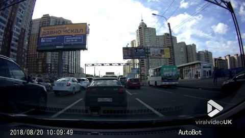 Cyclist gets caught by minibus door