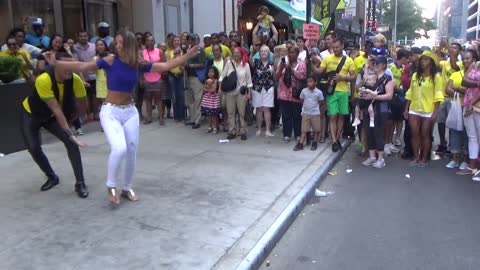 BRAZILIAN GIRL DANCES A BRAZILIAN SAMBA STREET DANCE AT BRAZILIAN CARNIVAL CULTURE PARTY NEW YORK