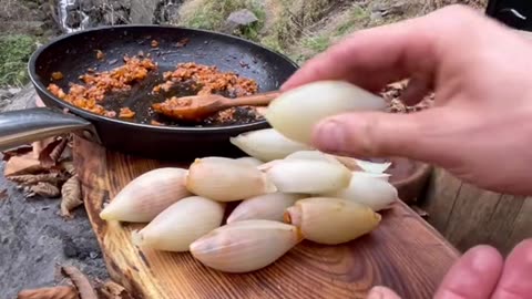 Onion wrap between lamb ribs