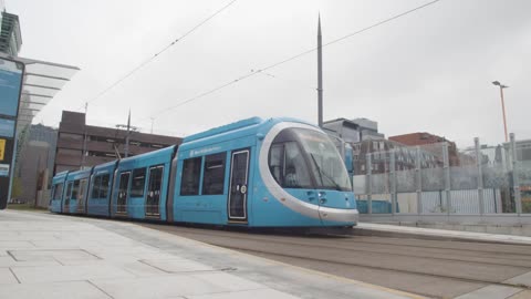 Tram Leaving Station Stop Platform In Birmingham UK 1