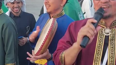 Malaysian and Saudi Fans doing the kompang dance outside Lusail Stadium