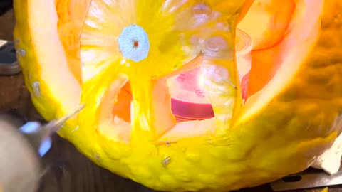 Carving A Cat's Rear End Into a Pumpkin