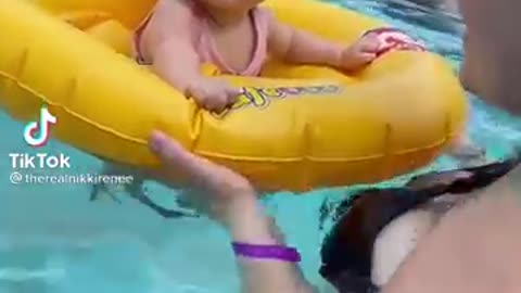 Baby dances in the pool