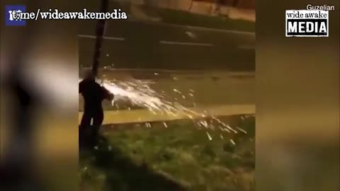 Yorkshire, England: Man uses a cordless angle grinder to cut down a surveillance camera