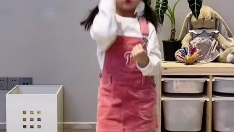 cute smiling girl dancing beautifully in baby's room