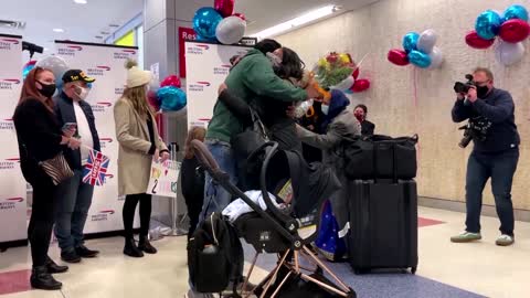 Families reunite at JFK as travel bans are lifted