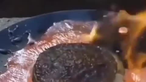 Epic video of a guy pouring lava over his McDonalds Big Mac.