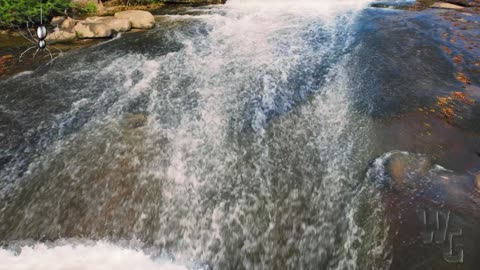 Waterfall Over Low Rocks Background 4K Loop