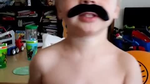 He's rockin' the stache! Git it, little man! 🥰