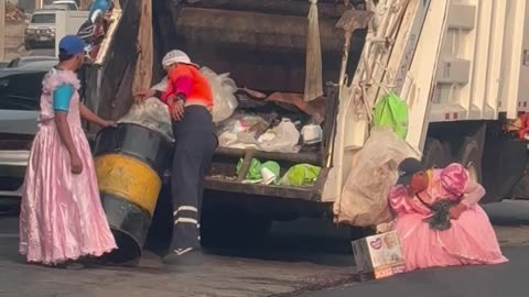 Trash Collectors Rock Pretty Pink Dresses