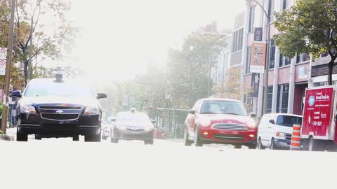 Cyclist Drive Near Cars On Fast Street