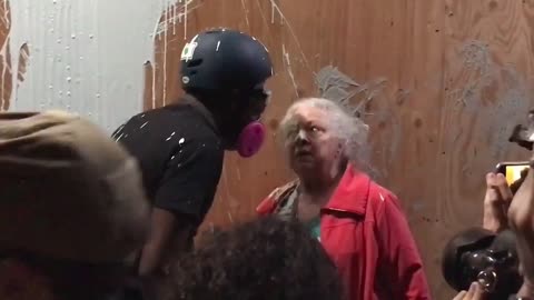 Rioters Throw Paint On Elderly Woman Trying To Protect Police Precinct