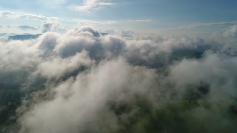 Clouds over mountains, aerial shot