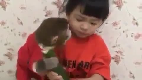 Cute baby and monkey