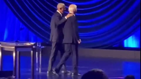 Obama ushers Biden off stage after he Froze up again.