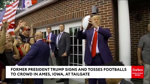 WATCH_ Trump Tosses Footballs To Crowd In Iowa.