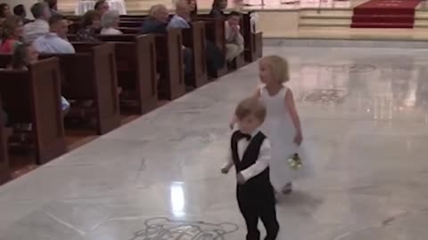 Children put some comedy at a wedding! - The ring bearer fails