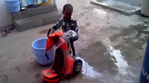 New bike is being bathed by this child