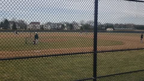 Logan hitting at baseball practice 2021