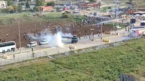 Turkish security forces disperse an angry crowd outside the U.S.