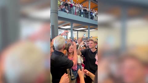 Apple's Tim Cook surprises customers, staff in Madrid