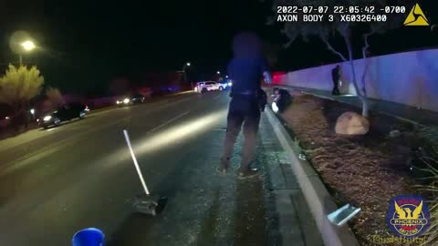 Phoenix officer picks up pills from the street after the driver threw them out