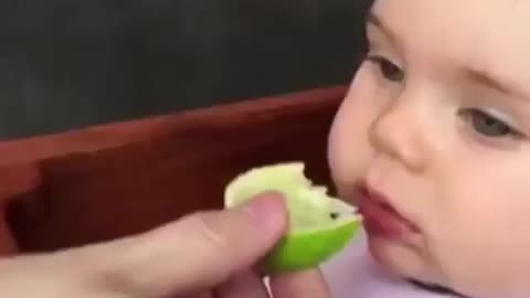 A baby's reaction after tasting first time lemon