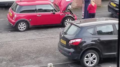 A Local Priest Cleanses A Car Of Demonic Influence