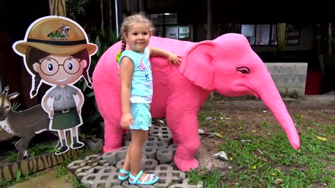 Feed animals at the zoo family trip.