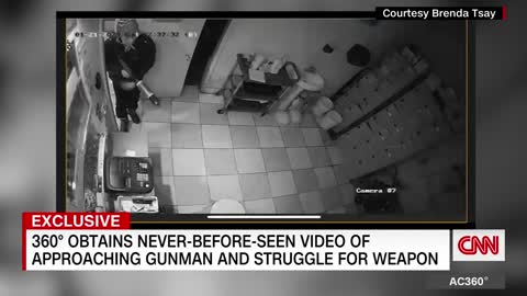 Surveillance footage shows hero confronting suspected gunman