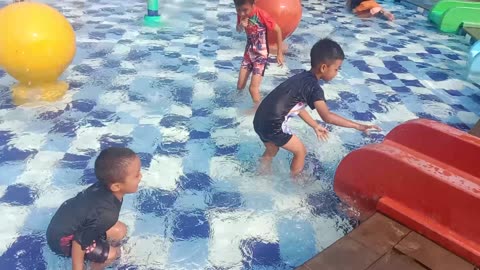 little boy is swimming