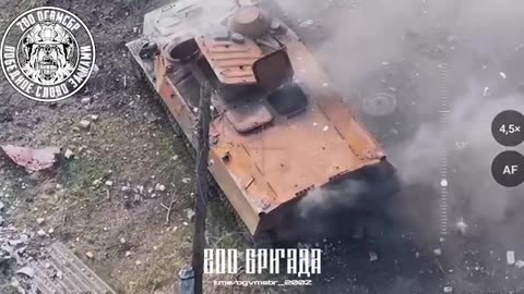 Drone Bomber Attacks Two Ukrainians Hiding in a Burnt MT-LB