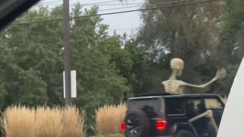 Giant Skeleton Rides in Backseat