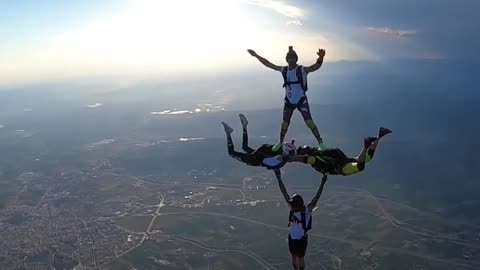 Four Men Make Cool Formation in Air While Sky Diving