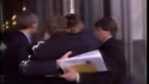 Bill Gates gets a cream pie to the face while walking into conference