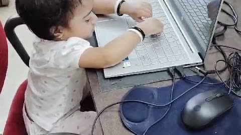 Baby working on Laptop